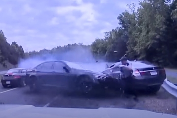 Wild video shows moment cop narrowly cheats death by dodging careening BMW